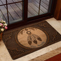 American Native dreamcatcher doormat styled inside a glass entry door with warm home decor