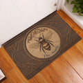 Bee doormat displayed in an entryway on warm wood flooring beside a white door