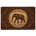 Ornate brown elephant doormat design with floral scrollwork and a vintage decorative frame