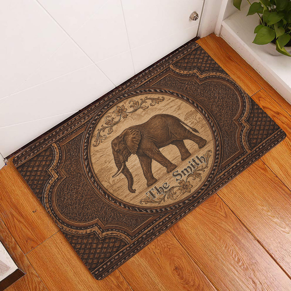 Vintage elephant doormat placed at an indoor doorway on warm wood flooring