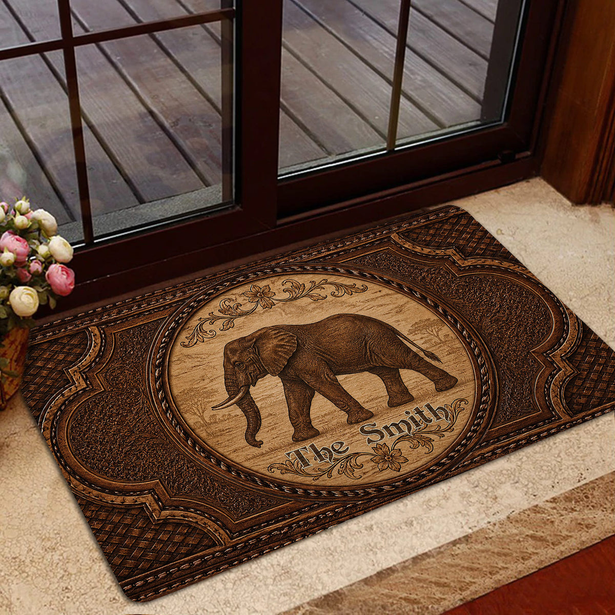 Decorative elephant doormat styled inside a home entrance beside a glass door