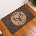 Ornate deer skull hunting doormat displayed at a home entrance on a warm wood floor