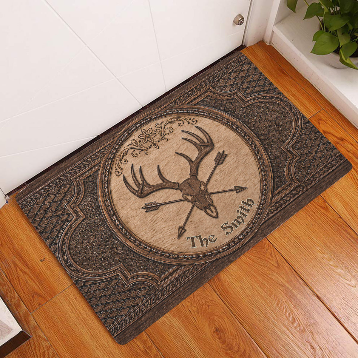 Ornate deer skull hunting doormat displayed at a home entrance on a warm wood floor