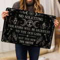 Lifestyle view of a person holding a black Wicca doormat with pentacle and triple moon design