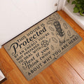 Wicca entryway doormat featuring protective artwork, crystals, pentagram, and cleansing bundle by a door