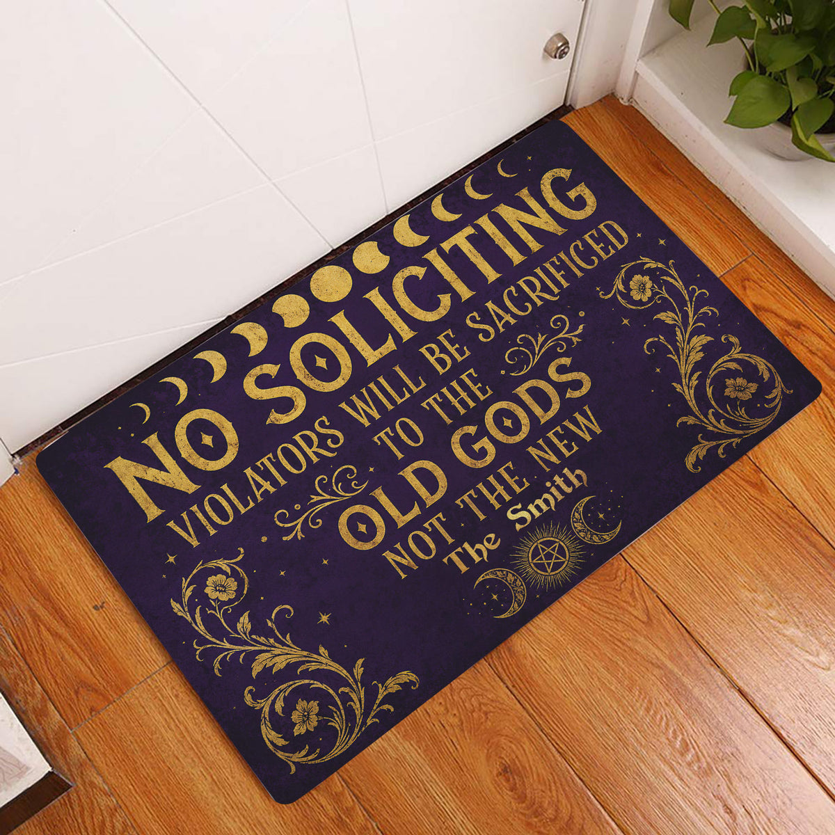 Wicca doormat displayed at an indoor entryway with moon phase and gold floral artwork