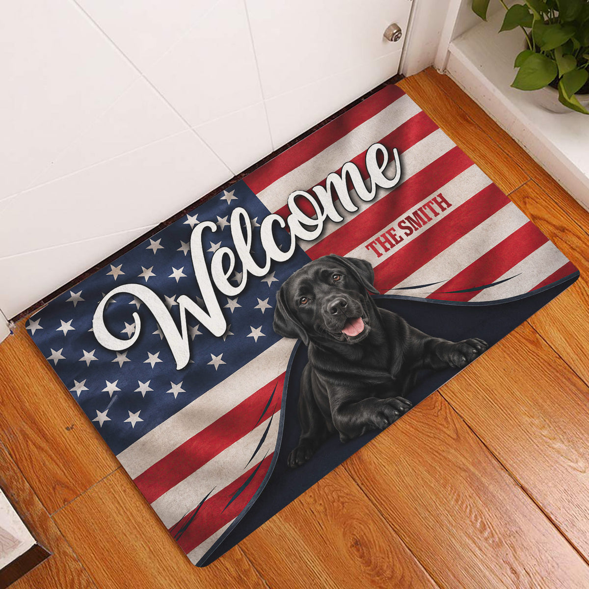 Labrador Retriever welcome doormat styled at an indoor front door on a wood floor