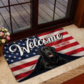 Labrador Retriever entryway mat with flag artwork positioned near a glass door