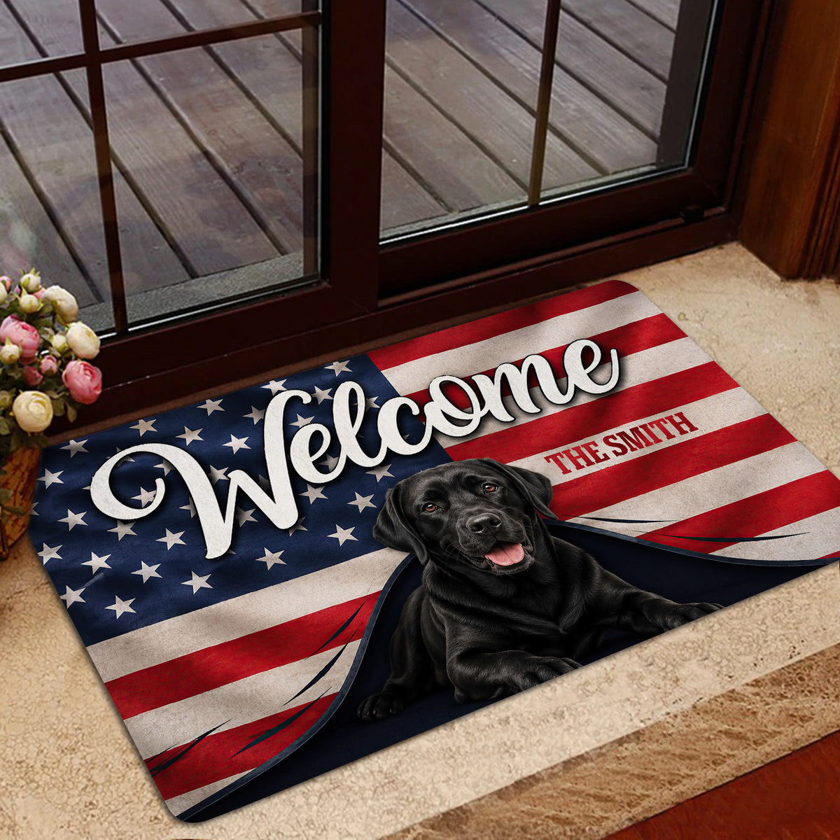 Labrador Retriever entryway mat with flag artwork positioned near a glass door