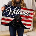Labrador Retriever doormat held indoors, showing the patriotic welcome design