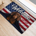 Dachshund welcome rug with stars and red, white, and blue flag-inspired artwork near a doorway