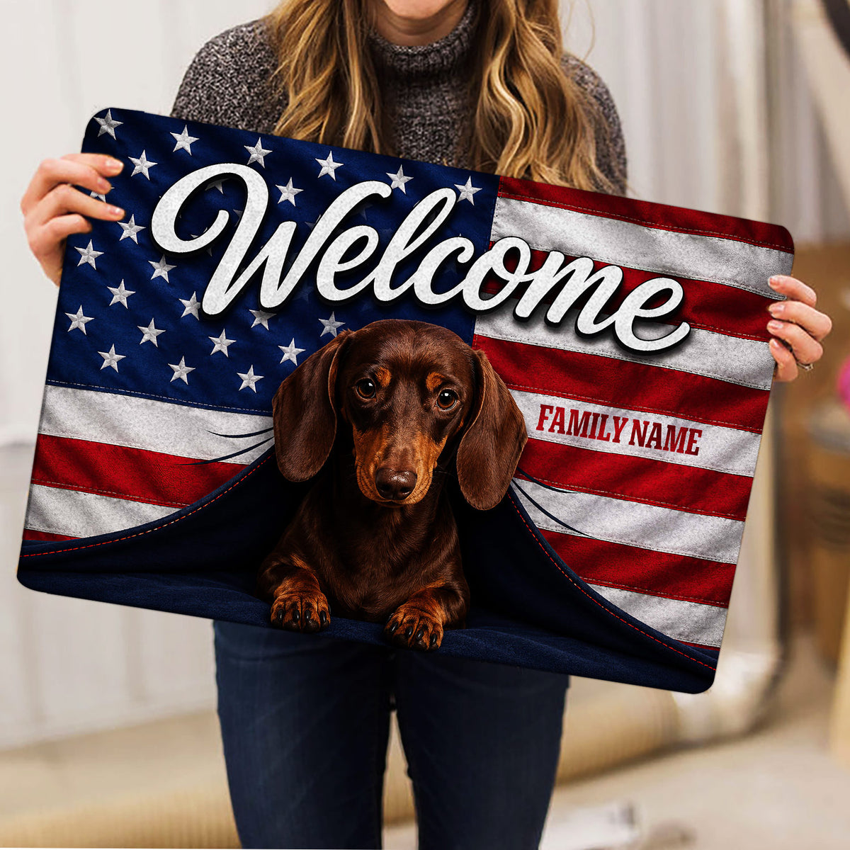 Brown dachshund welcome doormat held indoors, featuring stars, stripes, and a bold patriotic design
