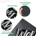 Feature view showing the French Bulldog doormat's printed surface and black rubber backing