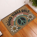 Hippie peace-and-love doormat displayed in a wood-floor entryway