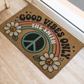 Colorful hippie doormat with peace symbol and flowers beside a doorway