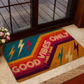 Rock and roll doormat displayed near a glass door with bold orange, teal, red, and gold artwork