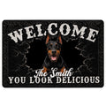 Black Doberman doormat with a cracked stone design, bold welcome lettering, and dramatic entryway artwork