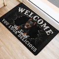 Black Doberman entryway rug positioned beside a bright doorway with bold distressed lettering