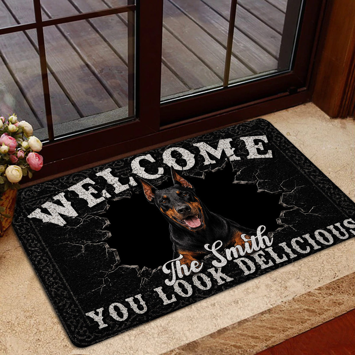 Doberman door mat styled in a home entrance near a glass door and indoor flooring