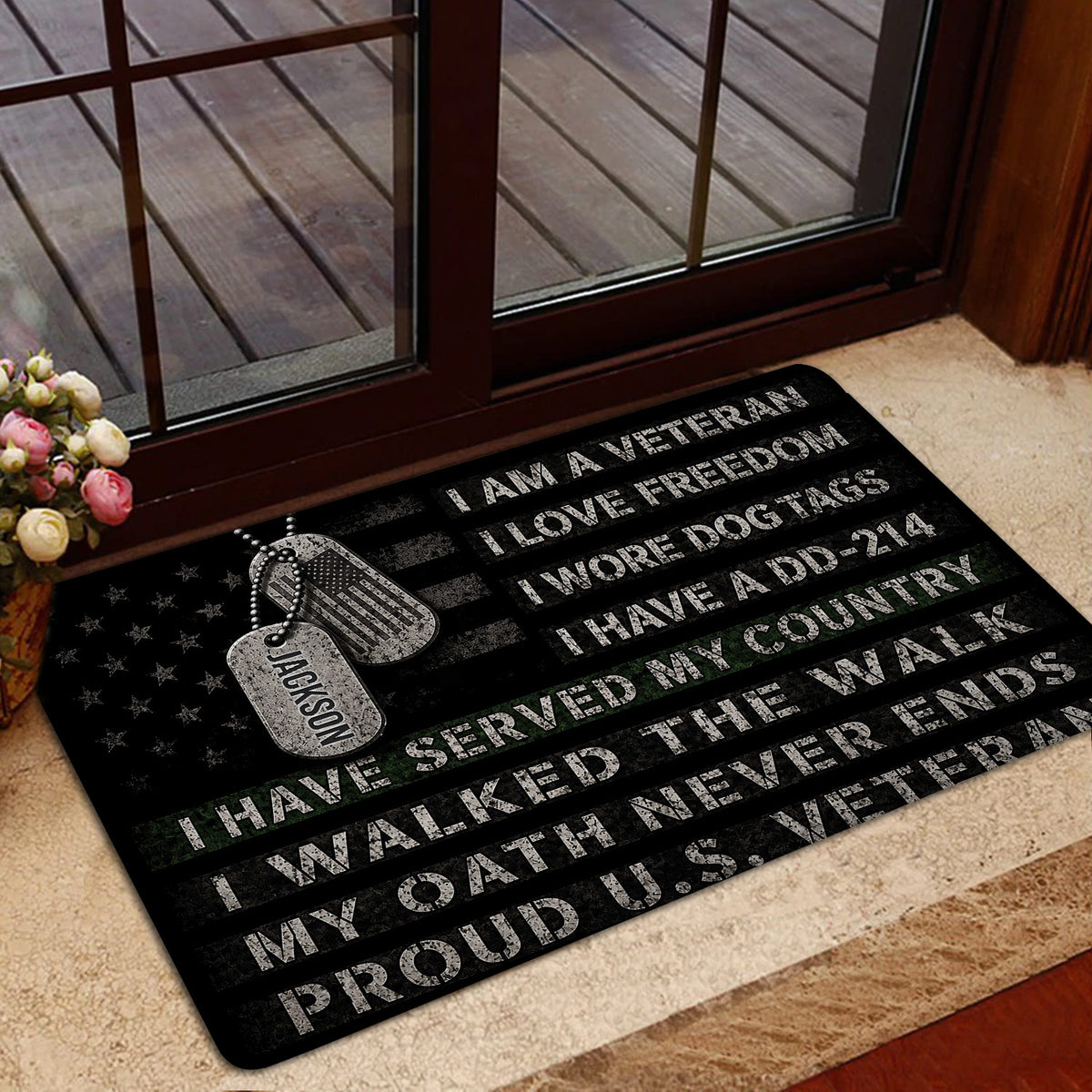 Veteran-themed entryway rug shown near a glass door with flag-inspired black artwork