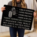 Person holding a patriotic veteran doormat featuring dog tags and bold tribute artwork