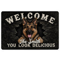 German Shepherd doormat with bold welcome lettering, dark cracked-stone artwork, and a family-style message