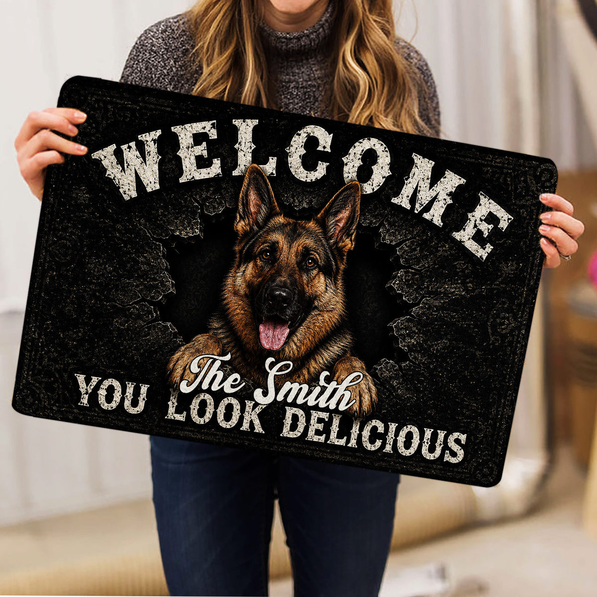 Person holding a German Shepherd doormat featuring a realistic dog portrait and bold welcome design