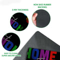 Close-up detail of the colorful LGBT doormat surface and black rubber backing