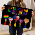 Black LGBT doormat displayed indoors with colorful Pride hearts and inclusive lettering
