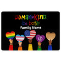 Black LGBT doormat with colorful pride hearts, hands, and a welcoming Human Kind message
