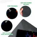 Close-up detail showing the black doormat surface, printed artwork, and rubber backing