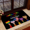 LGBT pride door mat styled in a home entrance with colorful heart and hand artwork