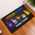 Rainbow LGBT cat doormat displayed in a bright home entryway on a wood floor