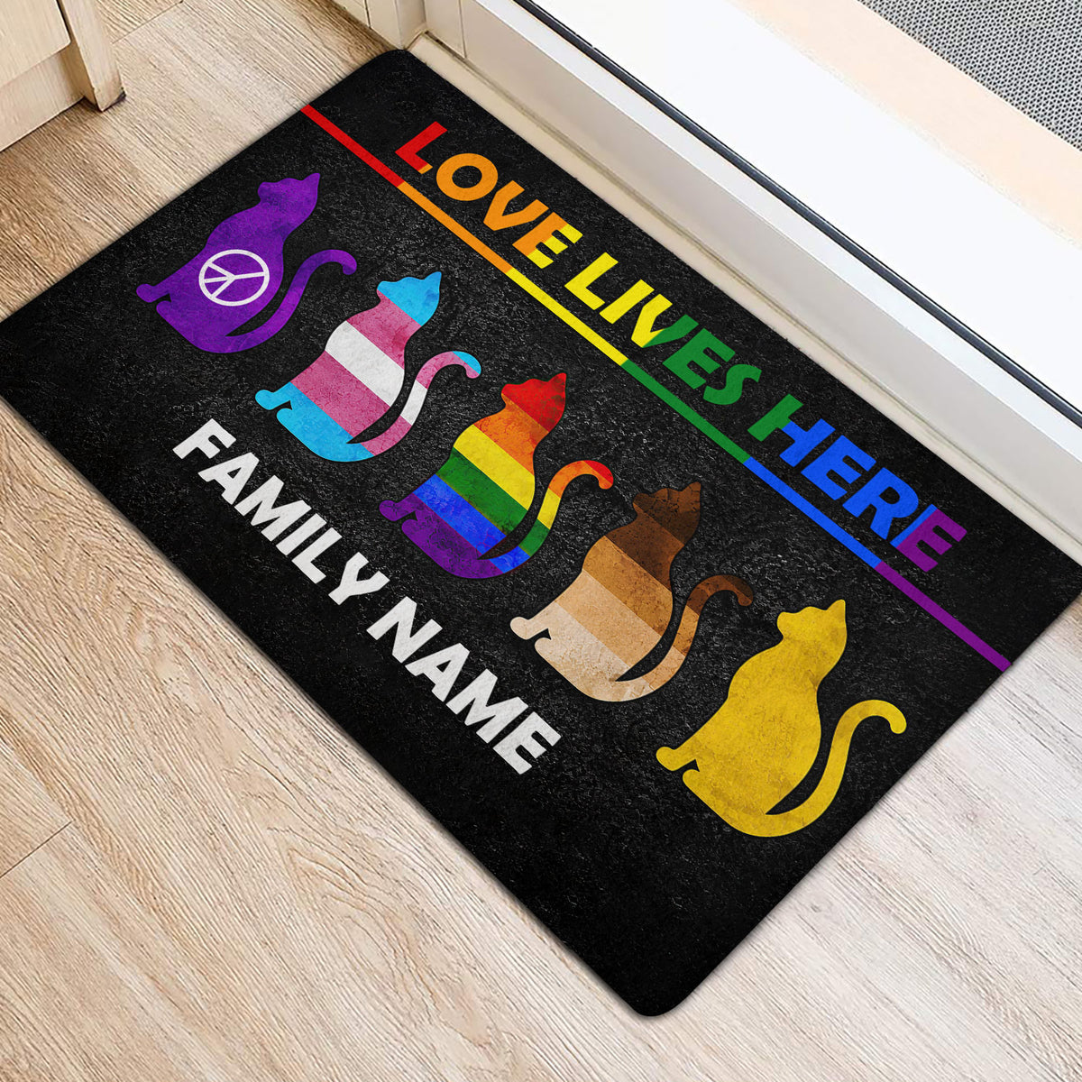 Colorful pride cat door mat positioned inside a home entrance near a doorway