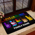 LGBT pride doormat with rainbow cats displayed by a glass entry door