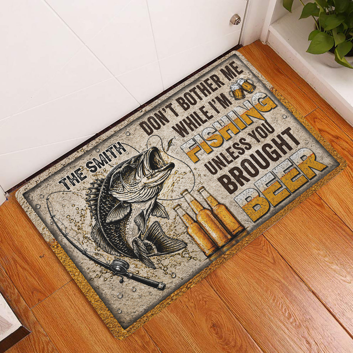 Fishing doormat displayed at an indoor entryway beside a white door on wood flooring