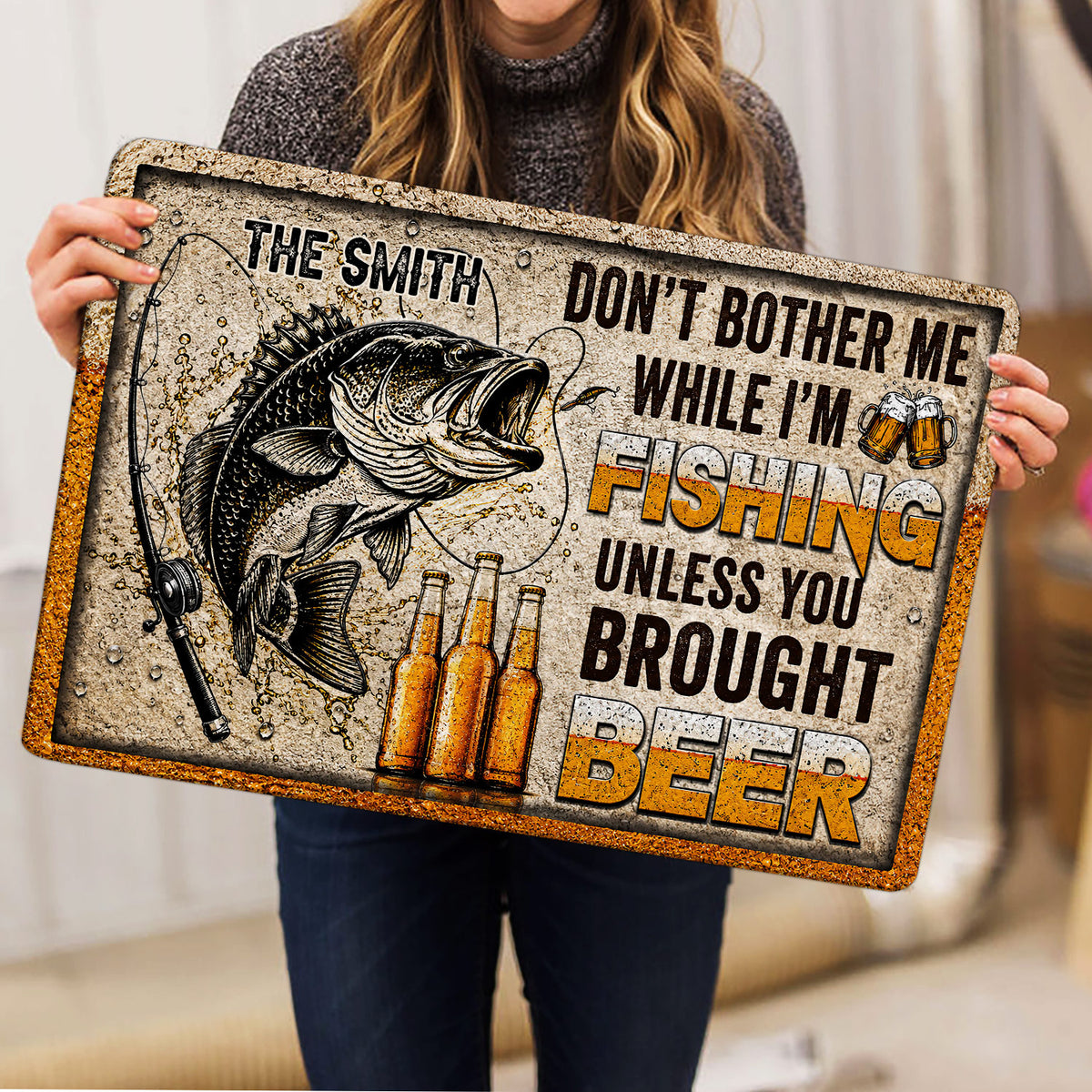 Fishing doormat held indoors showing a large fish, fishing rod, beer bottles, and bold graphic design