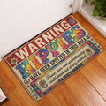 Hippie peace-and-love doormat displayed in a bright indoor entryway beside a white door