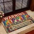 Hippie doormat styled at a home entrance with colorful peace symbols, flowers, and tie-dye lettering
