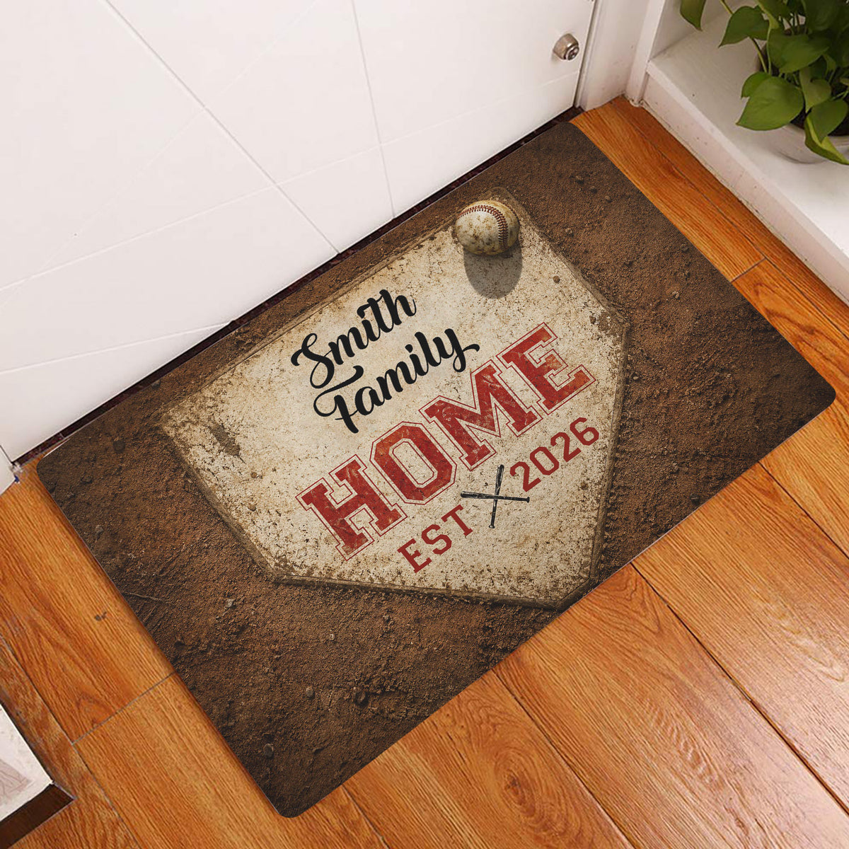 Baseball doormat displayed in a home entryway on hardwood flooring with vintage brown and red artwork