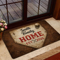 Baseball-themed entryway doormat displayed near a glass door with warm vintage home decor