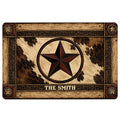 Cowboy doormat with a central western star, cowhide pattern, rustic wood frame, and ornate western border