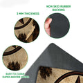 Close-up of the cowboy doormat surface and dark rubber backing showing the printed design and layered construction