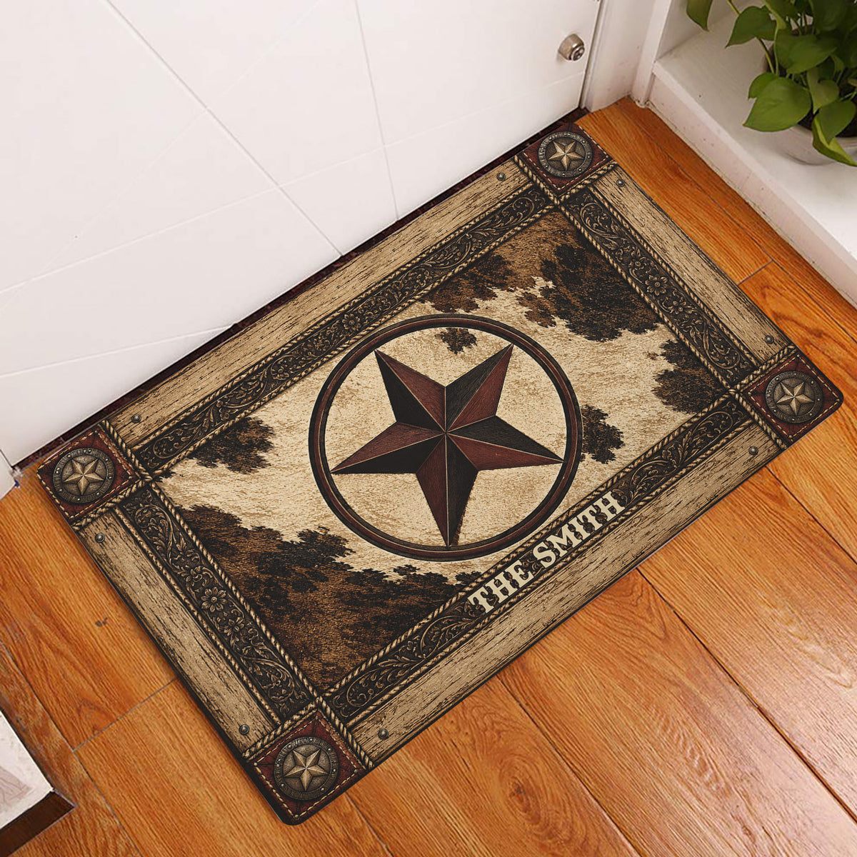 Cowboy western doormat displayed at an entryway with a central star, cowhide pattern, and rustic brown tones