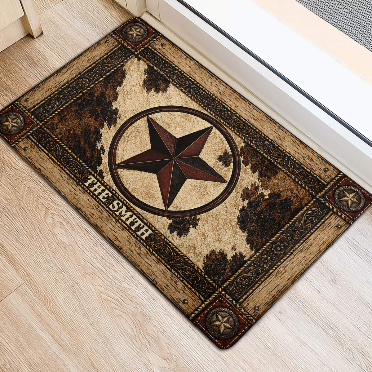 Western cowboy doormat placed near a doorway on light wood flooring with a star and cowhide-inspired design