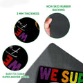 Close-up of the colorful LGBT doormat surface and textured rubber backing with rounded edges
