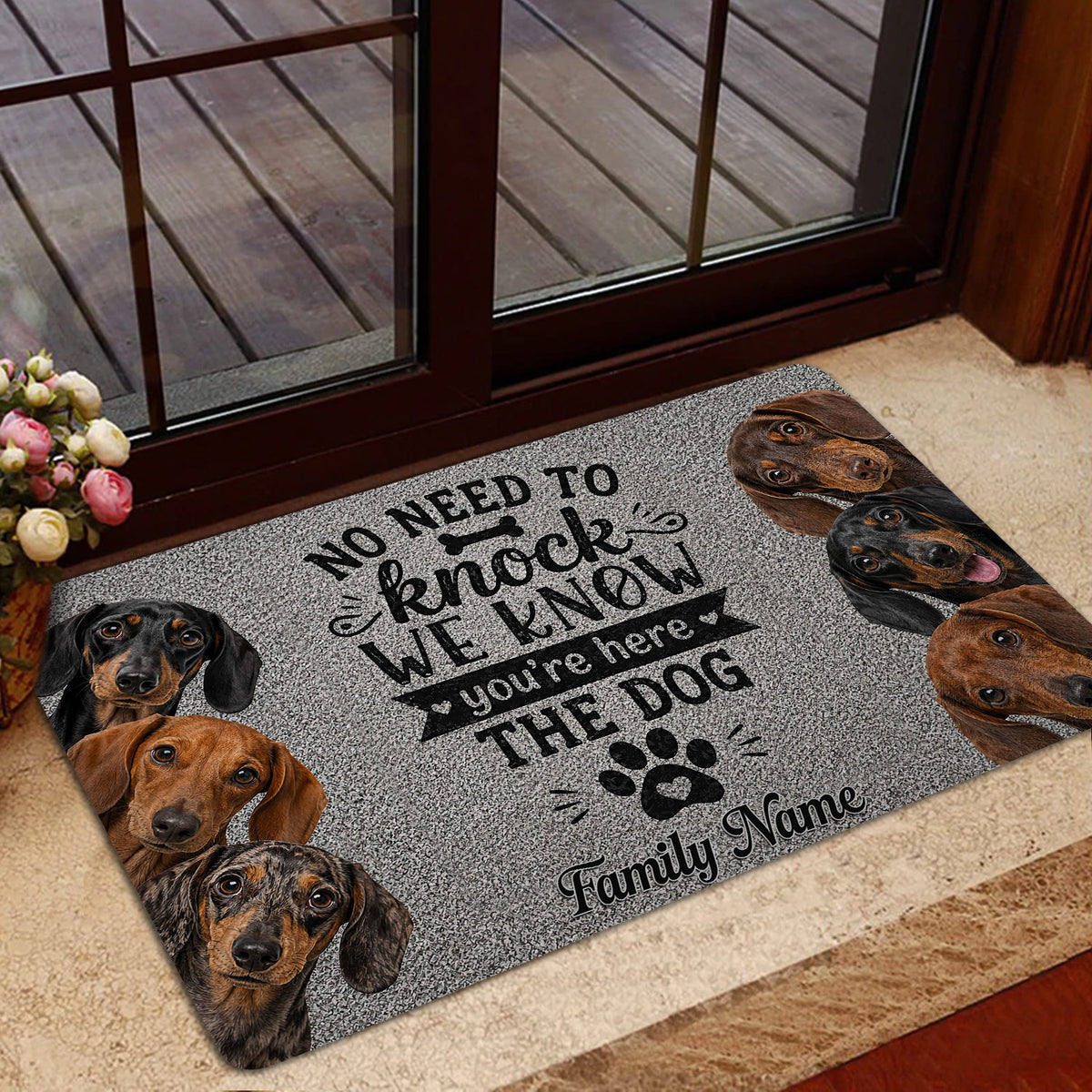 Dachshund doormat shown in a home entrance with a welcoming message and several dog portraits