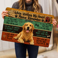 Person holding a Golden Retriever doormat featuring a smiling dog, paw prints, doghouse, and wood-plank design