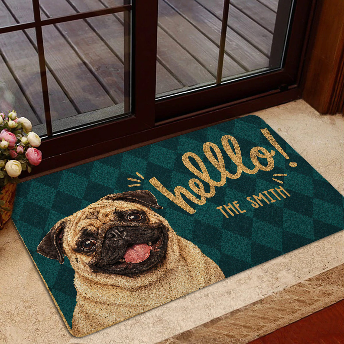 Pug door mat styled inside a glass doorway with dark teal and gold artwork