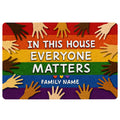 Colorful LGBT doormat with rainbow stripes, diverse hands, hearts, and an inclusive family welcome message